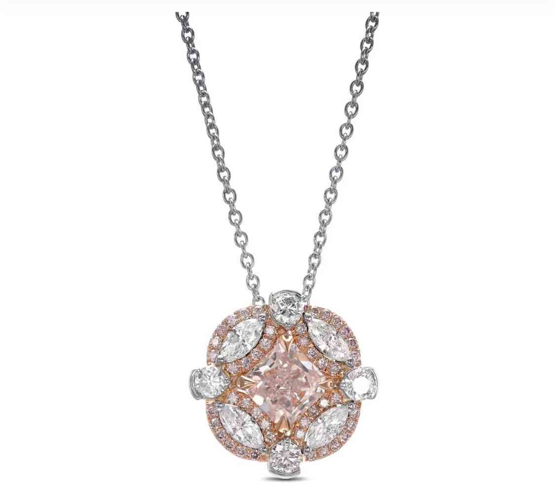 An extraordinary platinum couture fancy light pink radiant diamond pendant with a center diamond weighin
